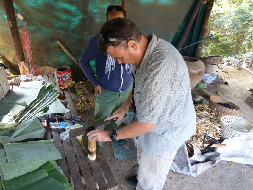 Greg making bamboo sticky rice treats in Battambang